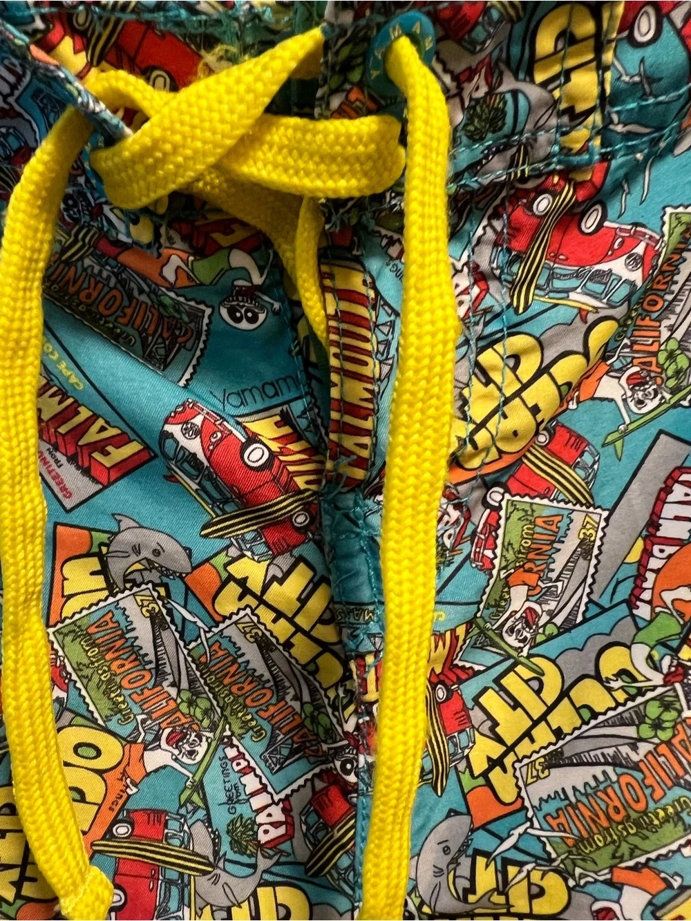 Turquoise Graphic Swim Shorts with Yellow Ocean Print